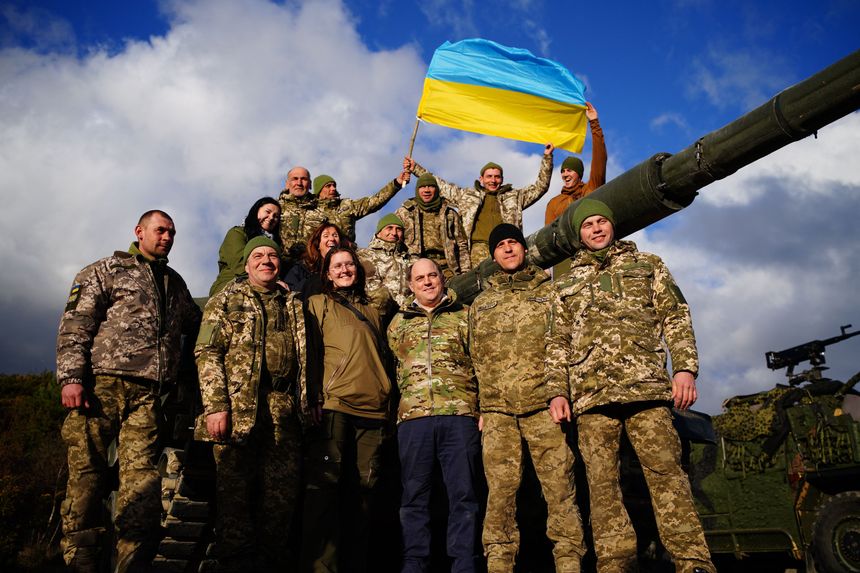 The British Minister of Defense poses on an English base with Ukrainian soldiers in front of a Challenger 2 tank bound for kyiv, February 22, 2023.